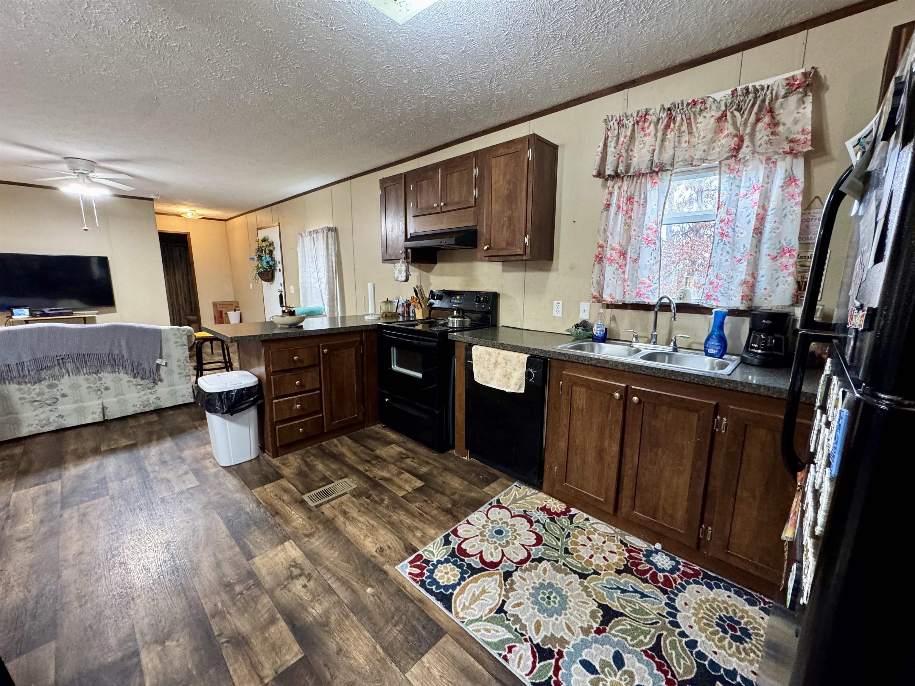 125 Elam Way Savannah, TN 38372 - Photo 14 of 36 a kitchen with stainless steel appliances a sink stove and cabinets