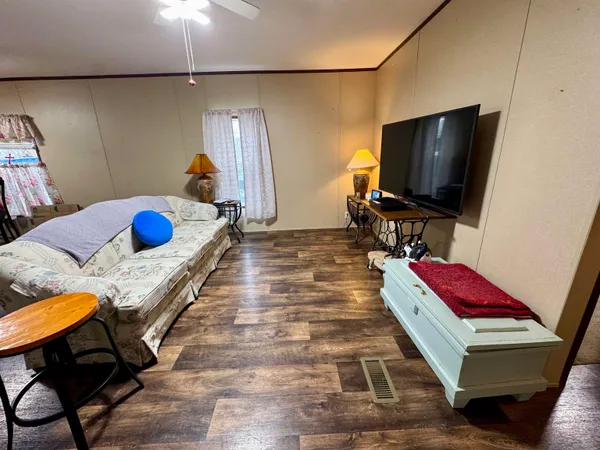 a bed sitting in a bedroom and mirror