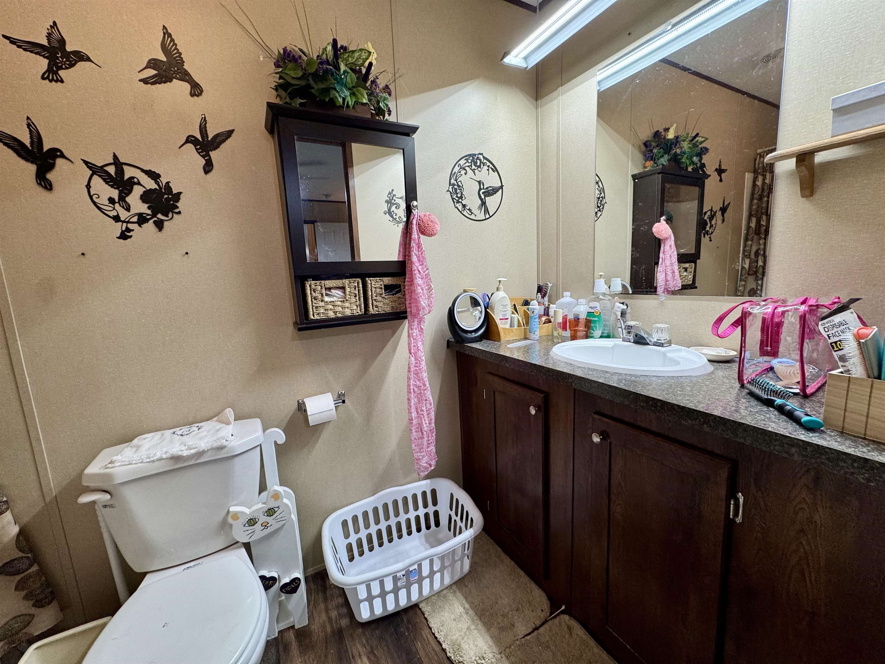 125 Elam Way Savannah, TN 38372 - Photo 19 of 36 a bathroom with a sink mirror and toilet