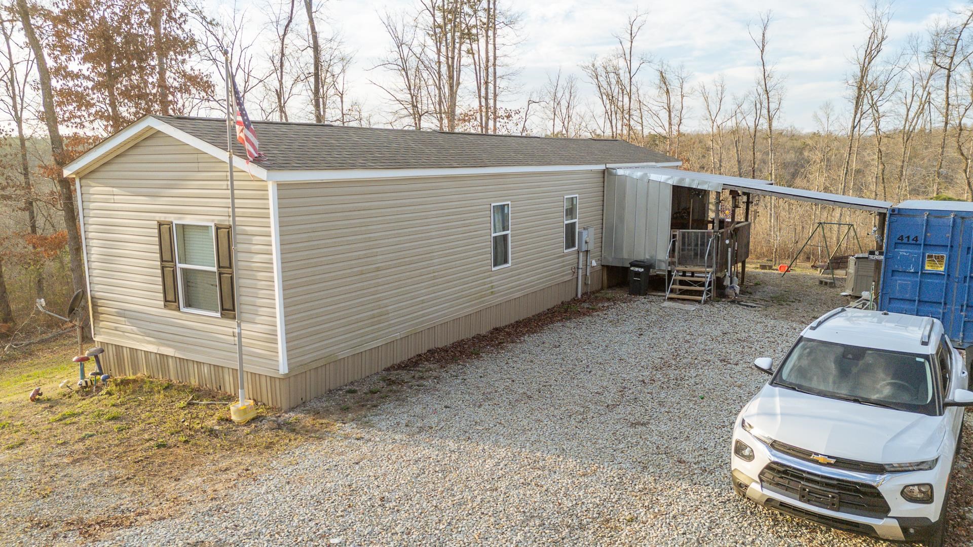 125 Elam Way Savannah, TN 38372 - Photo 26 of 36 a view of a backyard with sitting area