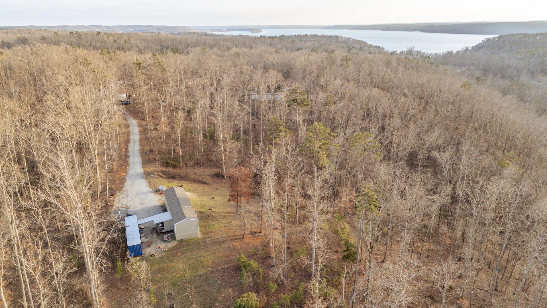 125 Elam Way Savannah, TN 38372 - Photo 28 of 36 Bird's eye view of a forest and a large body of water