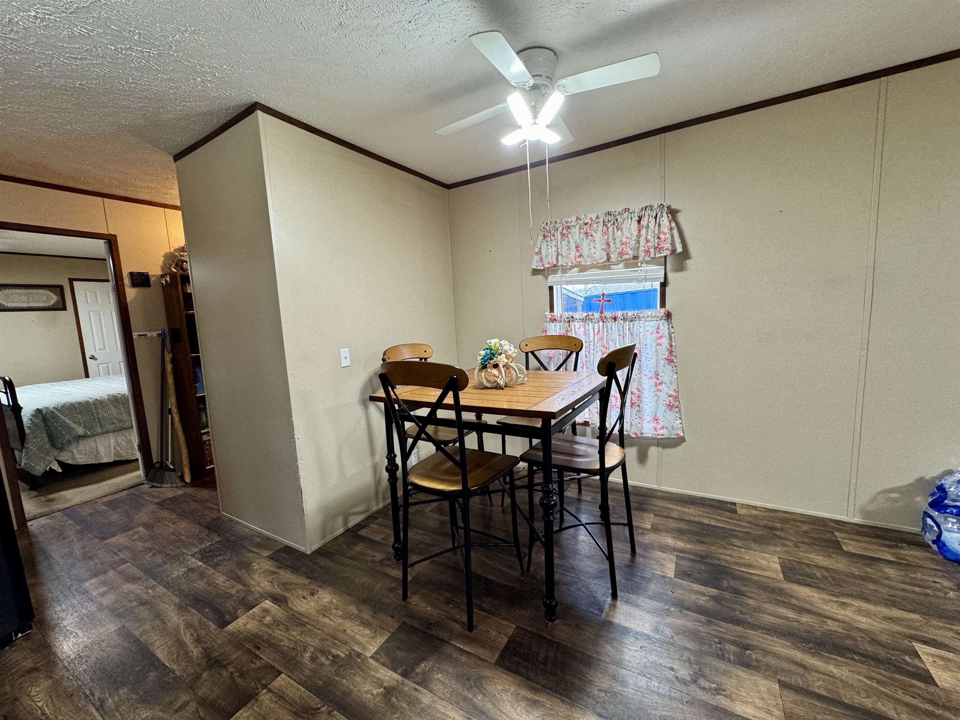 125 Elam Way Savannah, TN 38372 - Photo 5 of 36 a view of a dining room with furniture and wooden floor