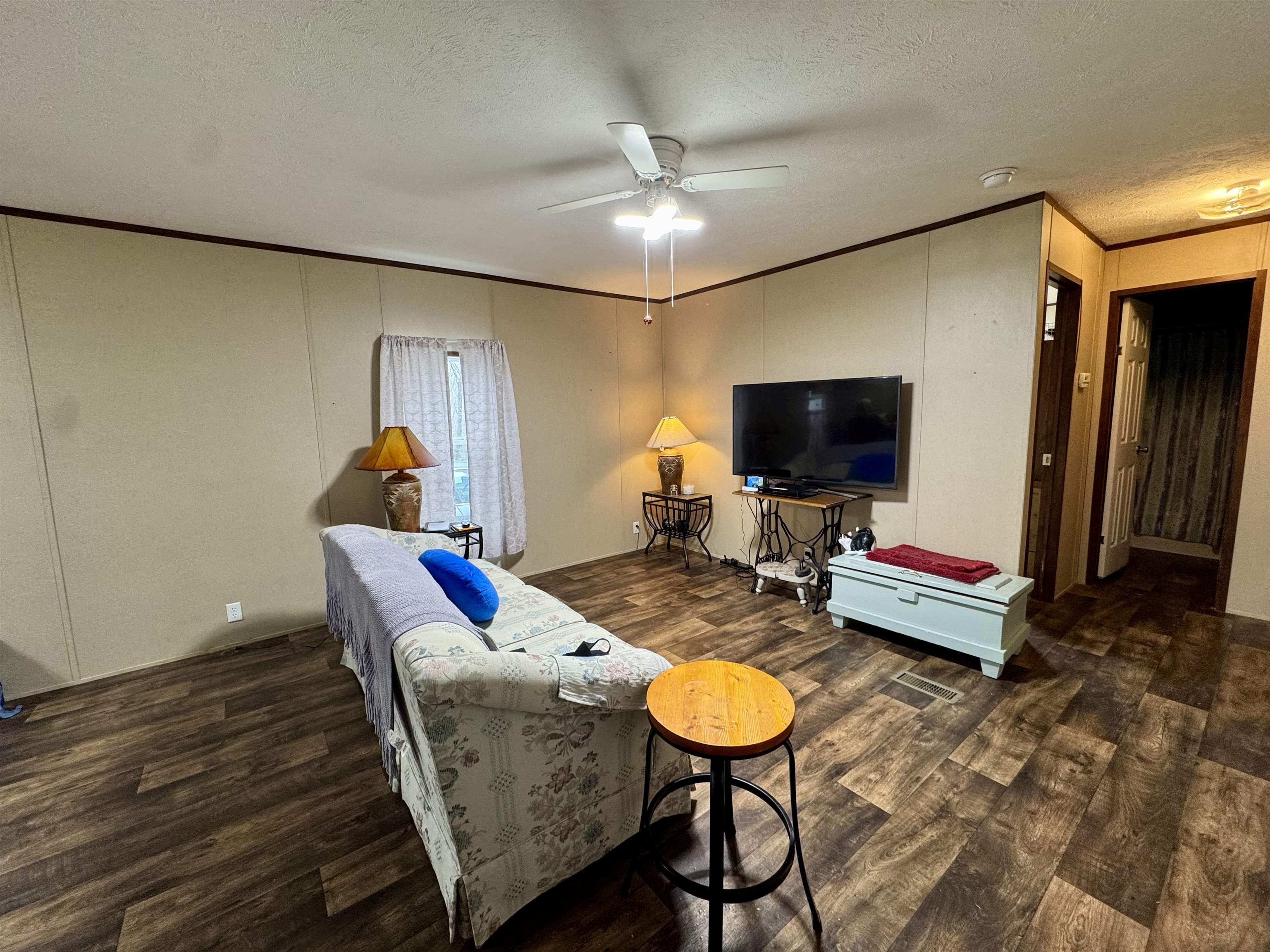 125 Elam Way Savannah, TN 38372 - Photo 7 of 36 a living room with furniture and a flat screen tv