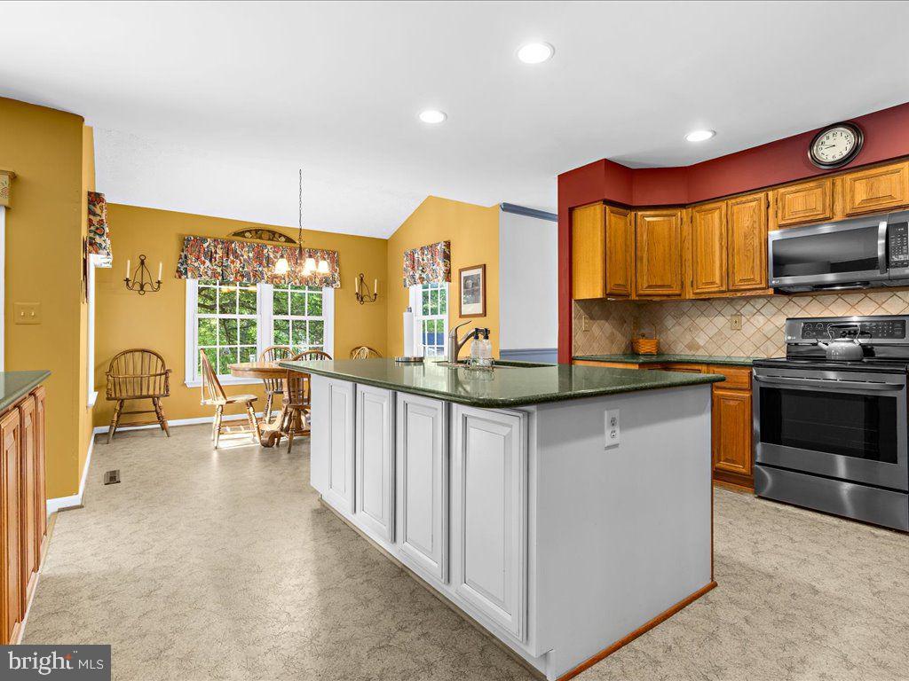 4561 Doncaster Drive Ellicott City, MD 21043 - Photo 13 of 30 Kitchen w/ Granite and Island