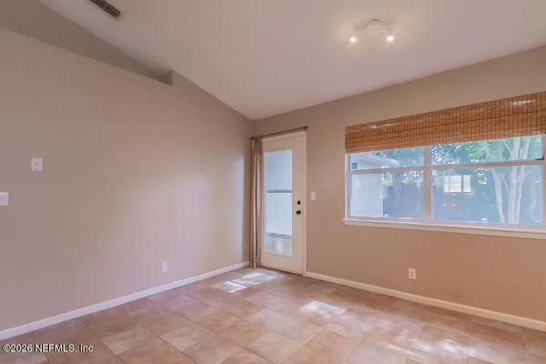 a view of an empty room with a window