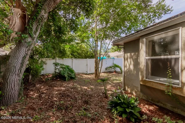a view of a back yard of the house