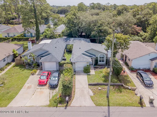 an aerial view of a house with swimming pool
