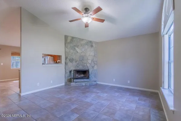 a view of an empty room with a window