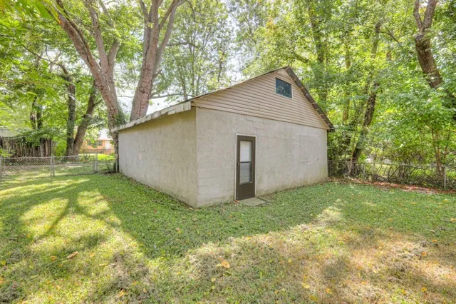 a backyard of a house with lots of green space
