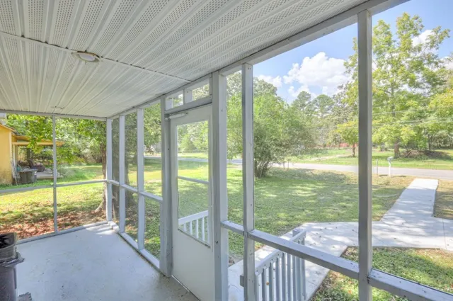 a view of a room with a large window