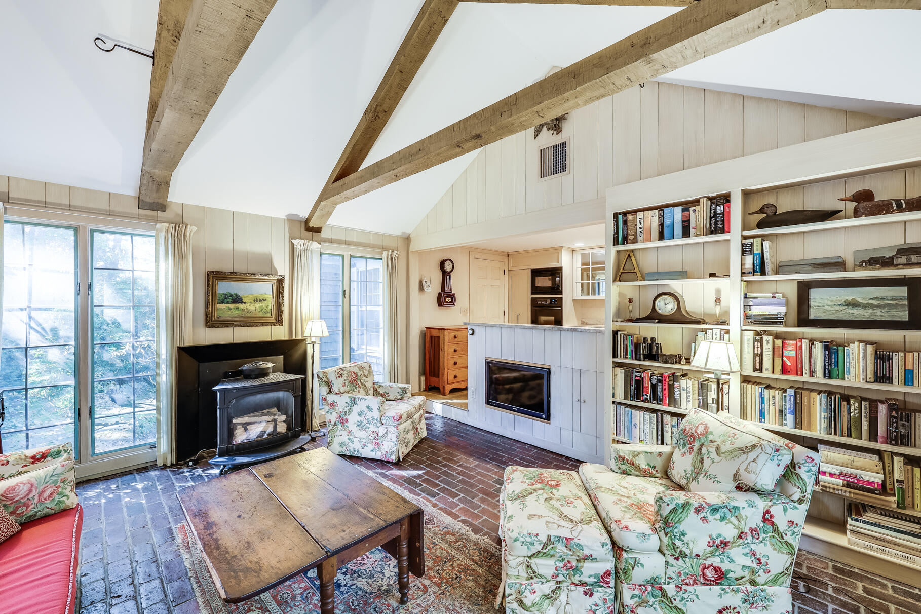 72 Hathaway Road Osterville, MA 02655 - Photo 14 of 40 a living room with fireplace furniture and a book shelf