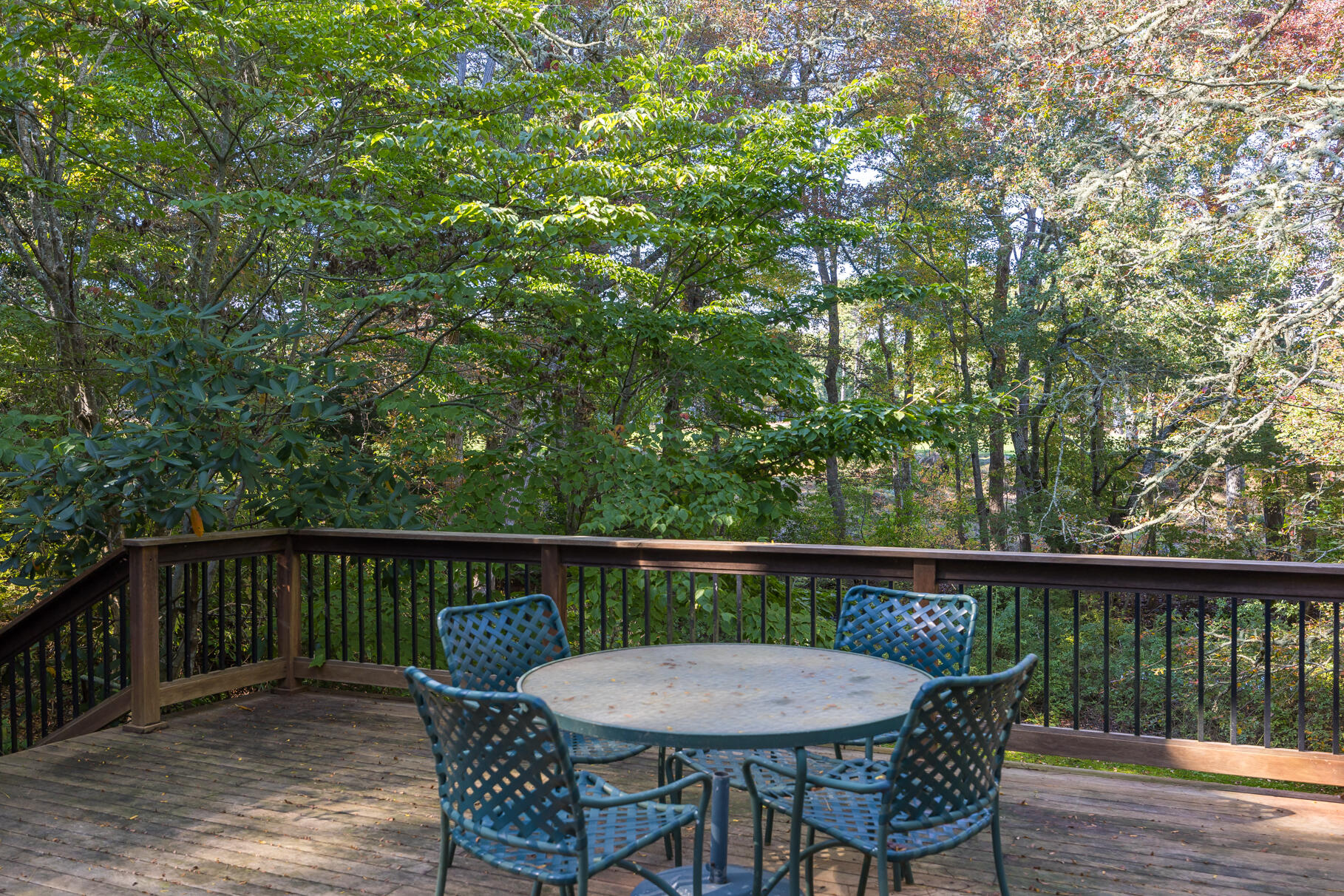 72 Hathaway Road Osterville, MA 02655 - Photo 18 of 40 a view of a deck with a table and chairs with wooden floor