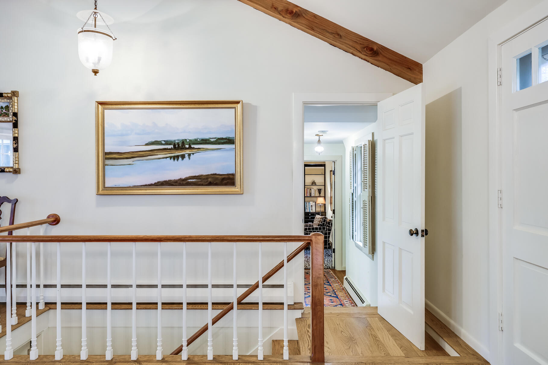 72 Hathaway Road Osterville, MA 02655 - Photo 27 of 40 a view of a hallway with wooden floor and staircase