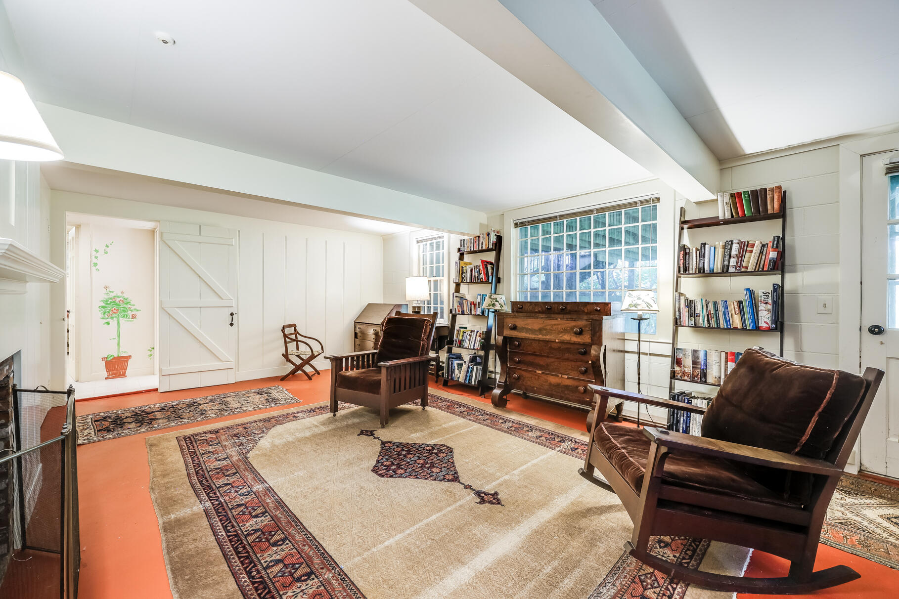72 Hathaway Road Osterville, MA 02655 - Photo 28 of 40 a living room with furniture a flat screen tv and a fireplace