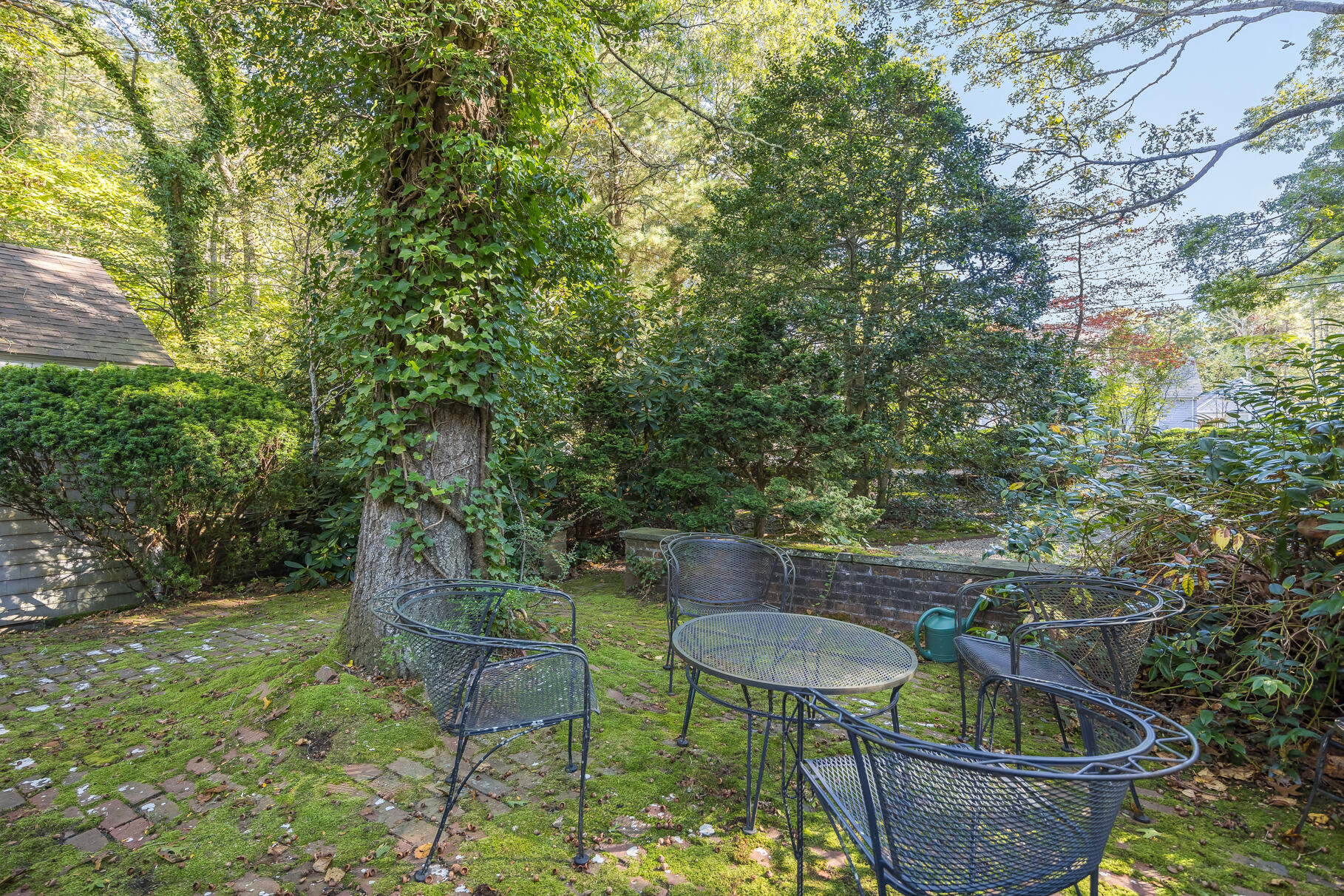 72 Hathaway Road Osterville, MA 02655 - Photo 32 of 40 a wooden table and chairs in a backyard