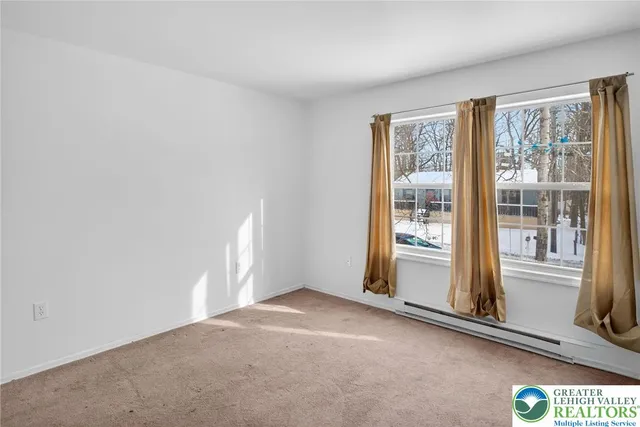 a view of a room with a large window