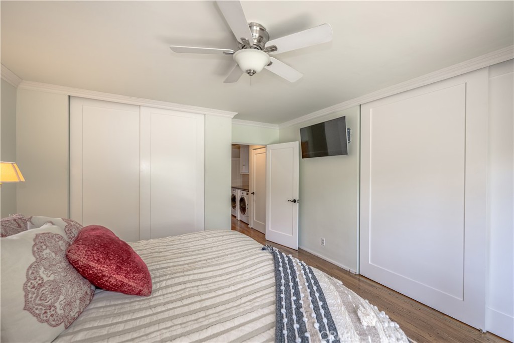 1865 Midwick Drive Altadena, CA 91001 - Photo 14 of 30 a bedroom with a large bed a chandelier and a window