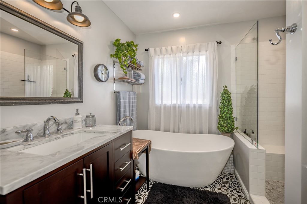 1865 Midwick Drive Altadena, CA 91001 - Photo 15 of 30 a spacious bathroom with a granite countertop sink and a mirror