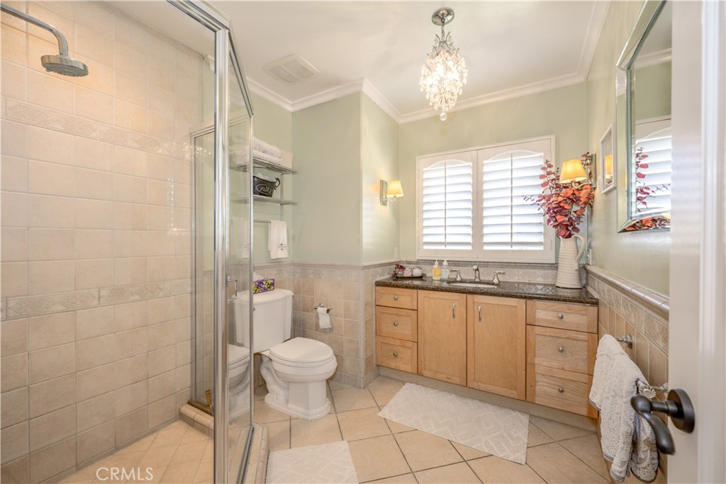 1865 Midwick Drive Altadena, CA 91001 - Photo 19 of 30 a bathroom with a granite countertop sink a toilet and shower