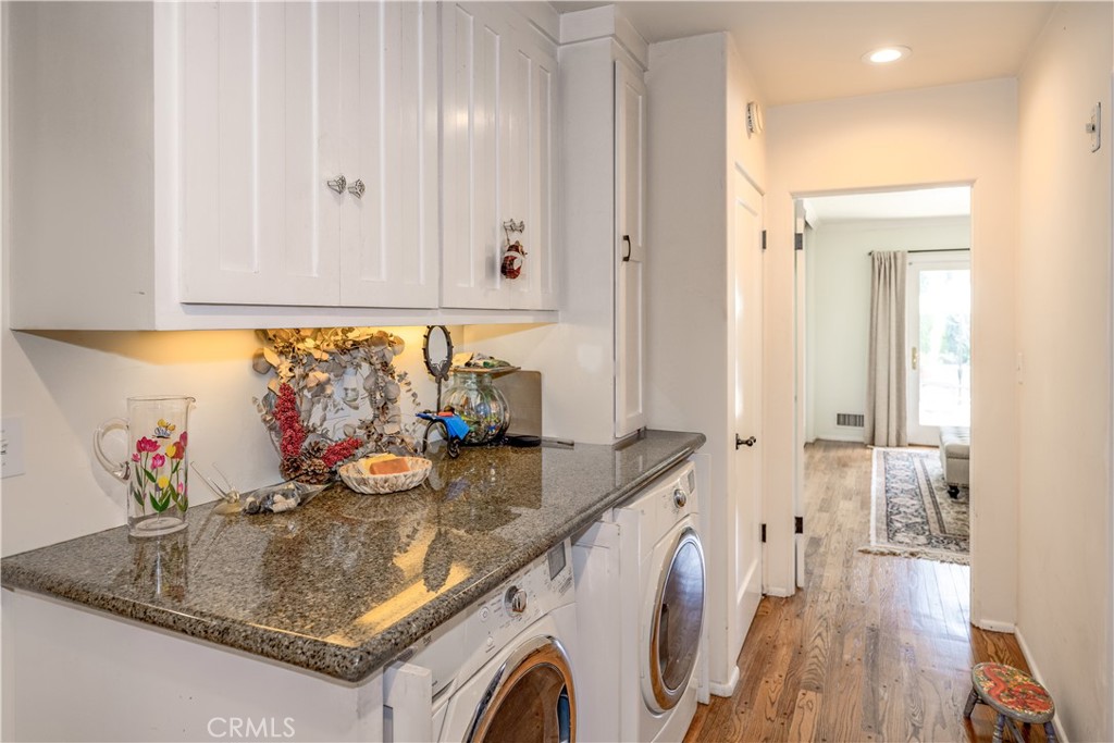 1865 Midwick Drive Altadena, CA 91001 - Photo 20 of 30 a view of kitchen island with granite countertop lots of clutter and washer