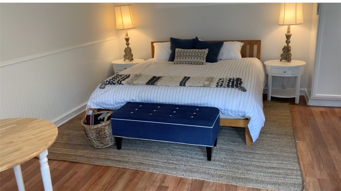 1865 Midwick Drive Altadena, CA 91001 - Photo 23 of 30 a bedroom with a bed and wooden floor