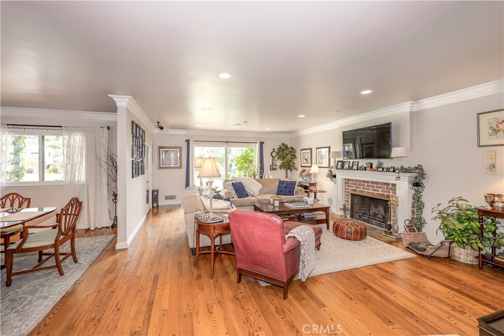 1865 Midwick Drive Altadena, CA 91001 - Photo 4 of 30 a living room with furniture a fireplace and a flat screen tv