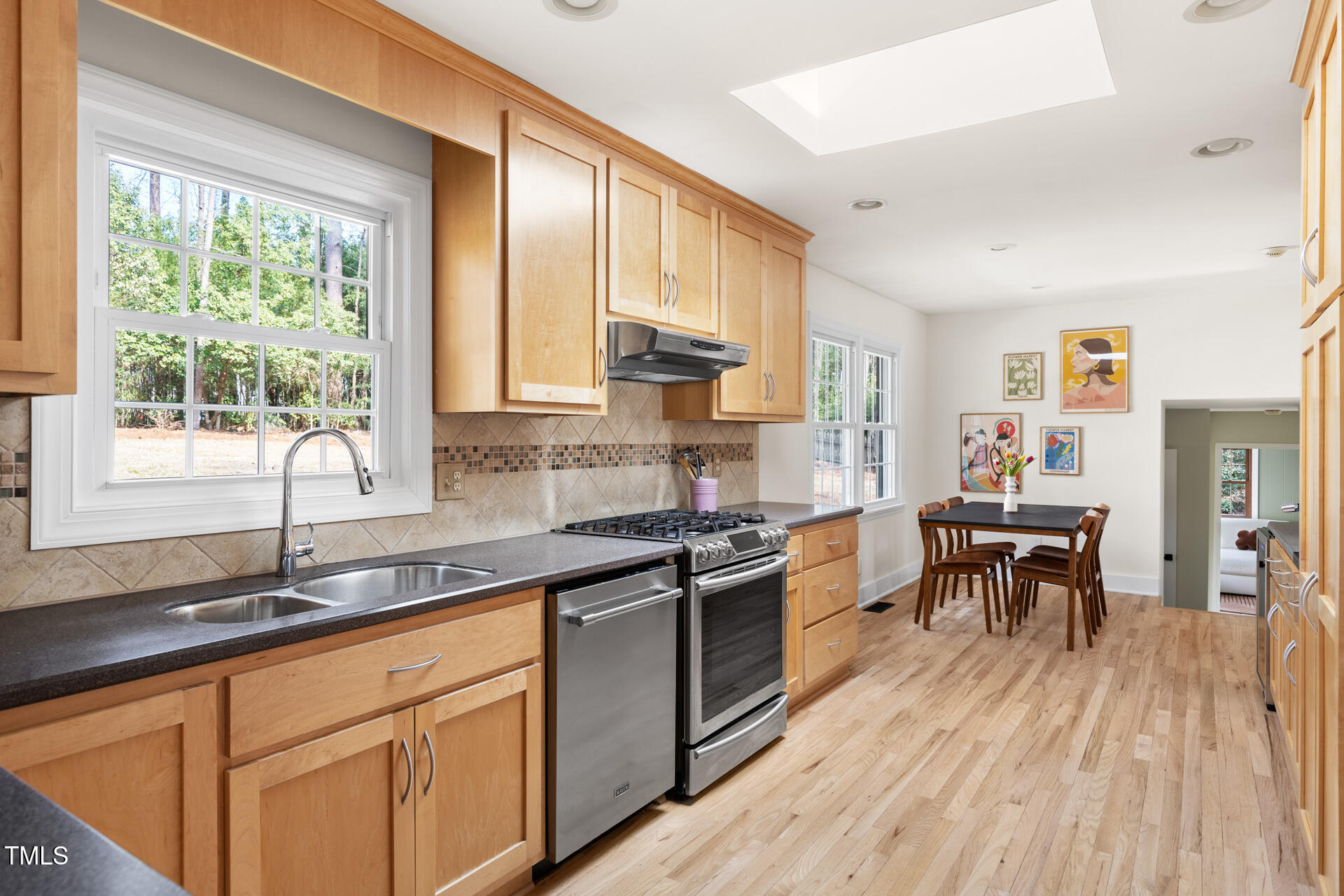 3520 Winding Way Durham, NC 27707 - Photo 10 of 26 a kitchen with stainless steel appliances granite countertop sink stove top oven and cabinets