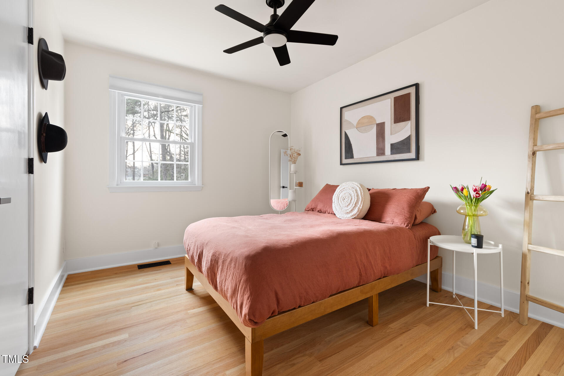 3520 Winding Way Durham, NC 27707 - Photo 16 of 26 a bedroom with a bed and wooden floor