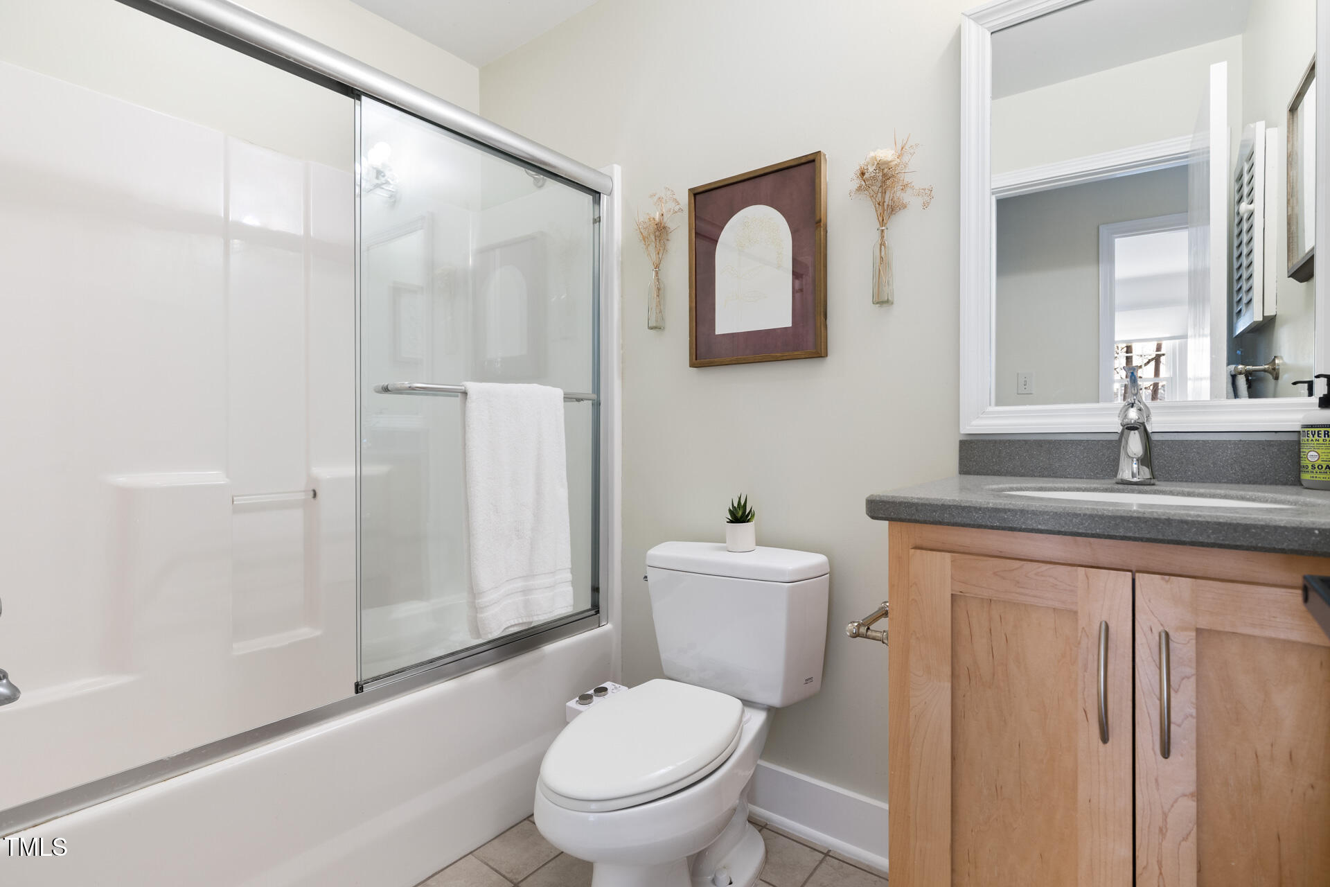 3520 Winding Way Durham, NC 27707 - Photo 17 of 26 a bathroom with a granite countertop toilet sink and shower