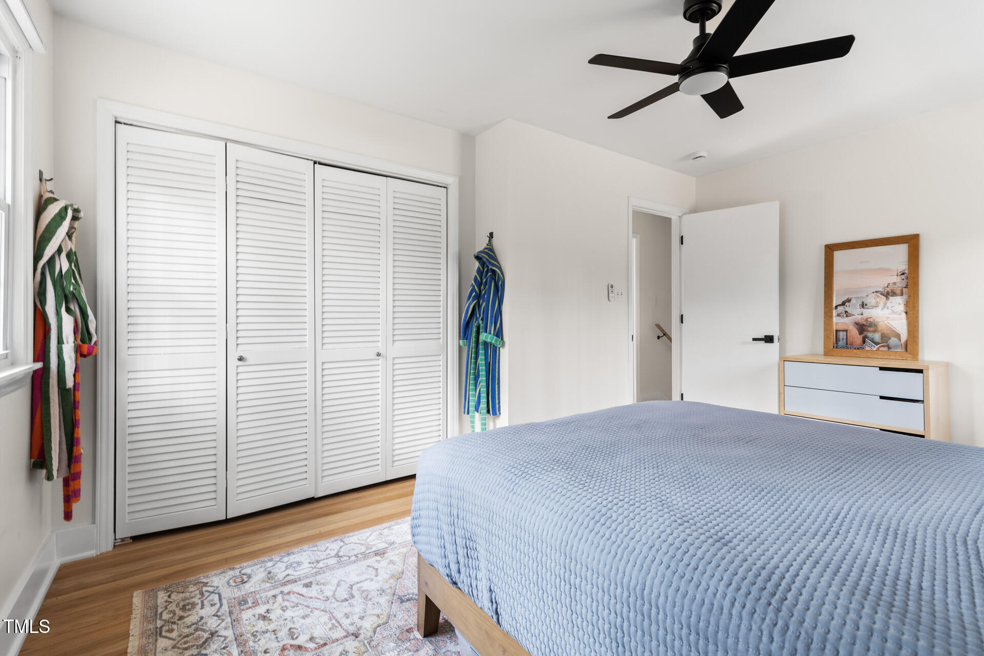 3520 Winding Way Durham, NC 27707 - Photo 19 of 26 a view of a bedroom with cabinet and door