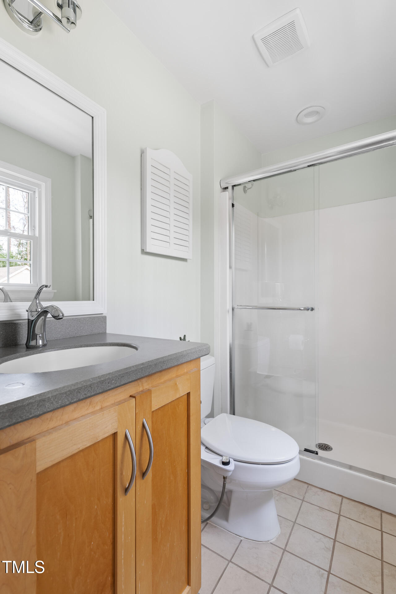 3520 Winding Way Durham, NC 27707 - Photo 21 of 26 a bathroom with a granite countertop sink mirror vanity and toilet