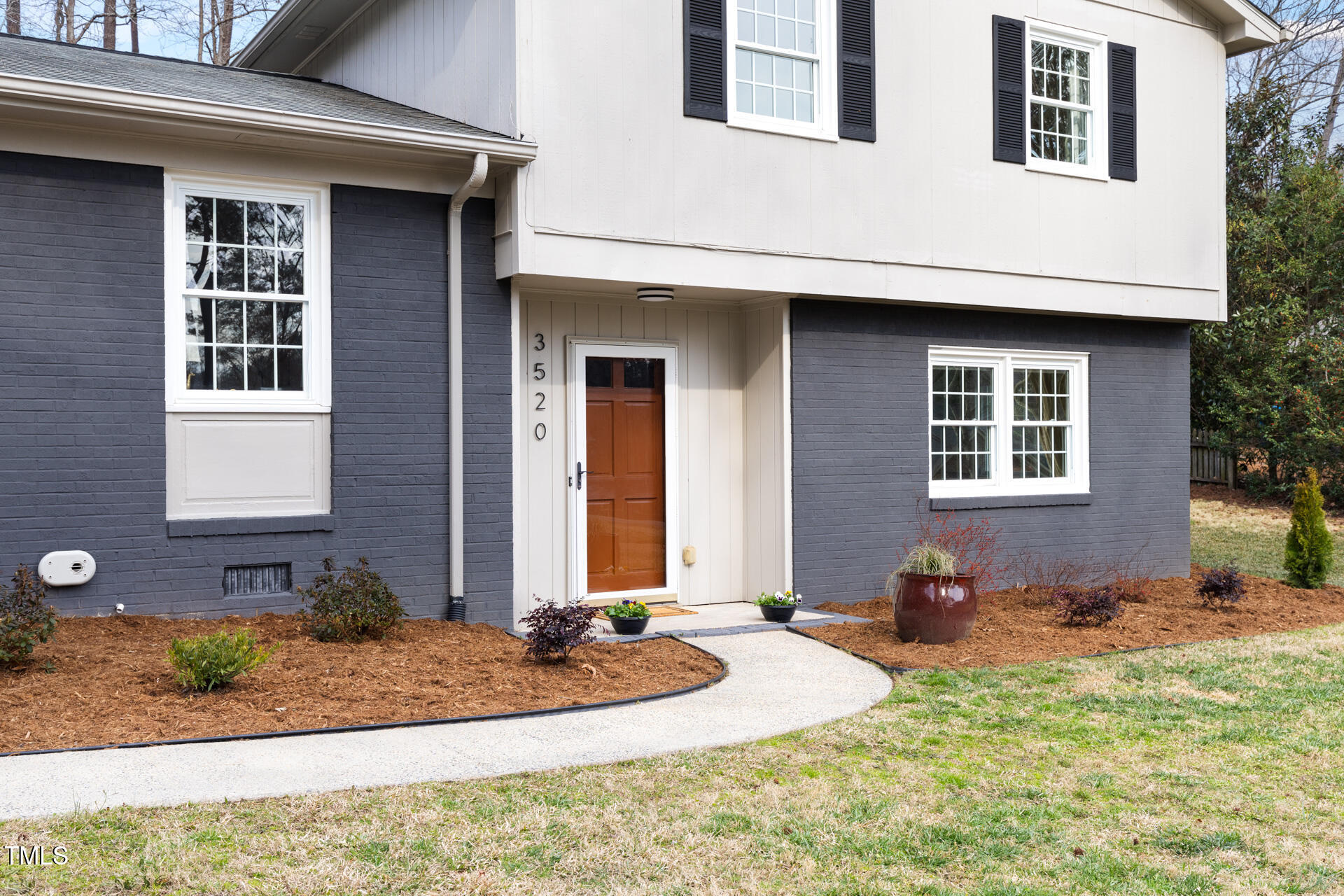 3520 Winding Way Durham, NC 27707 - Photo 2 of 26 a front view of a house with garden