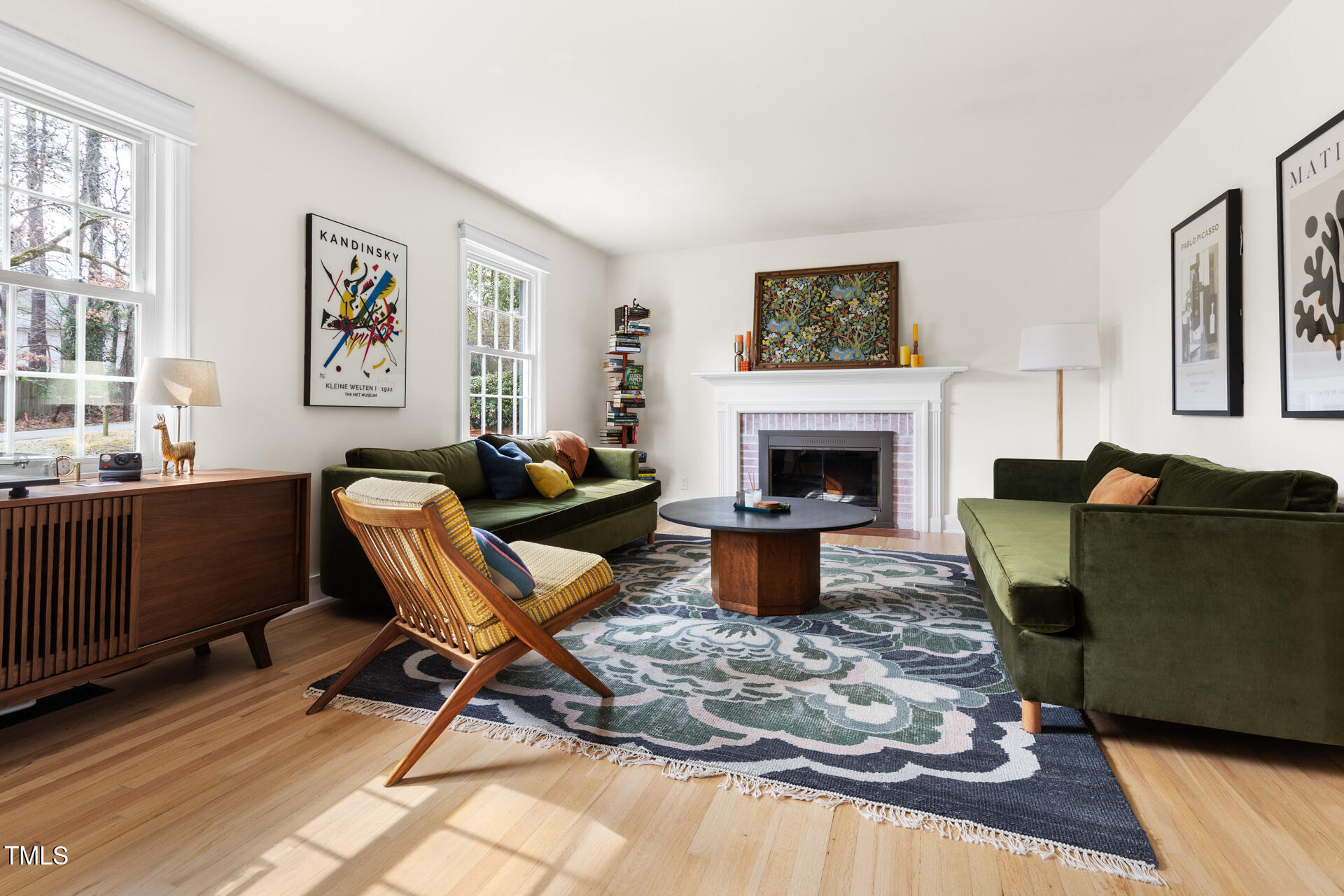 3520 Winding Way Durham, NC 27707 - Photo 4 of 26 a living room with furniture a flat screen tv and a fireplace