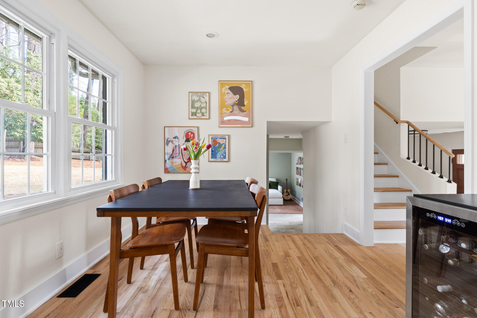 3520 Winding Way Durham, NC 27707 - Photo 7 of 26 a view of a dining room with furniture a chandelier and wooden floor