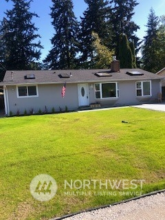 218 105th Street Southeast Everett, WA 98208 - Photo 11 of 12 a view of a house with a yard