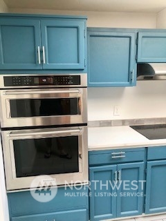 218 105th Street Southeast Everett, WA 98208 - Photo 3 of 12 a stove top oven sitting inside of a kitchen