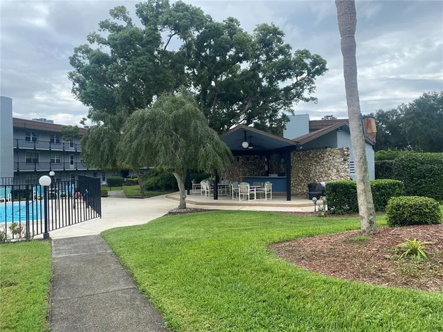 a view of a house with a yard porch and sitting area