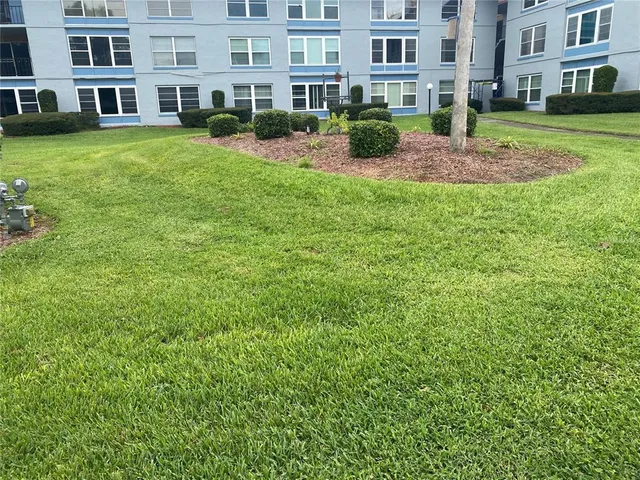 a view of a building with a yard