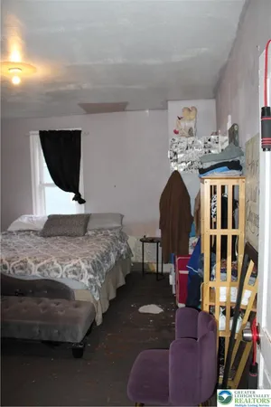 a view of walk in closet with clothes