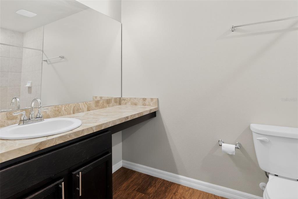 46 Sea Trail Palm Coast, FL 32164 - Photo 12 of 21 a bathroom with a granite countertop sink and a toilet