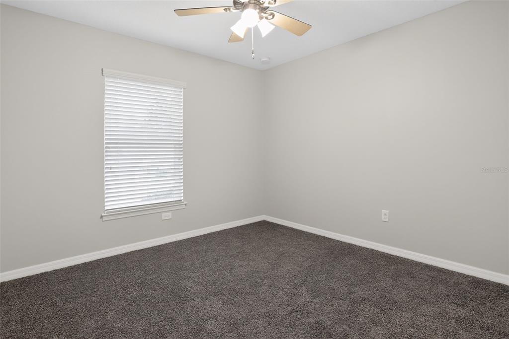 46 Sea Trail Palm Coast, FL 32164 - Photo 14 of 21 an empty room with a window