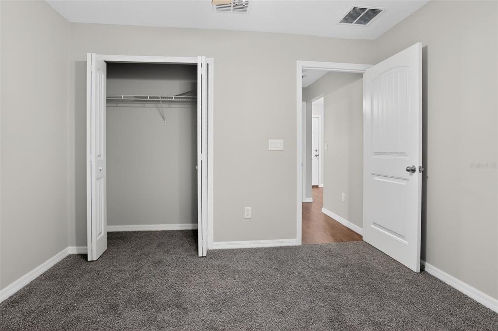 46 Sea Trail Palm Coast, FL 32164 - Photo 17 of 21 a view of an empty room with closet and a bathroom
