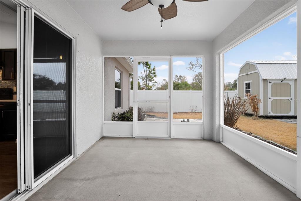 46 Sea Trail Palm Coast, FL 32164 - Photo 20 of 21 a view of an empty room with a window and chandelier