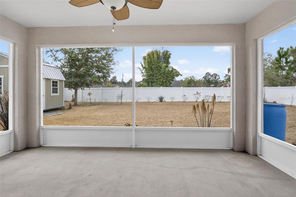 46 Sea Trail Palm Coast, FL 32164 - Photo 21 of 21 a view of a living room and a floor to ceiling window