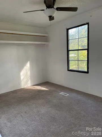 a view of empty room with windows