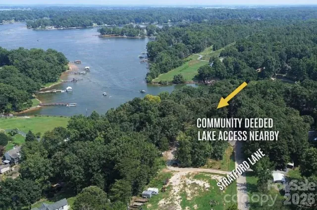 an outdoor space with seating area and trees