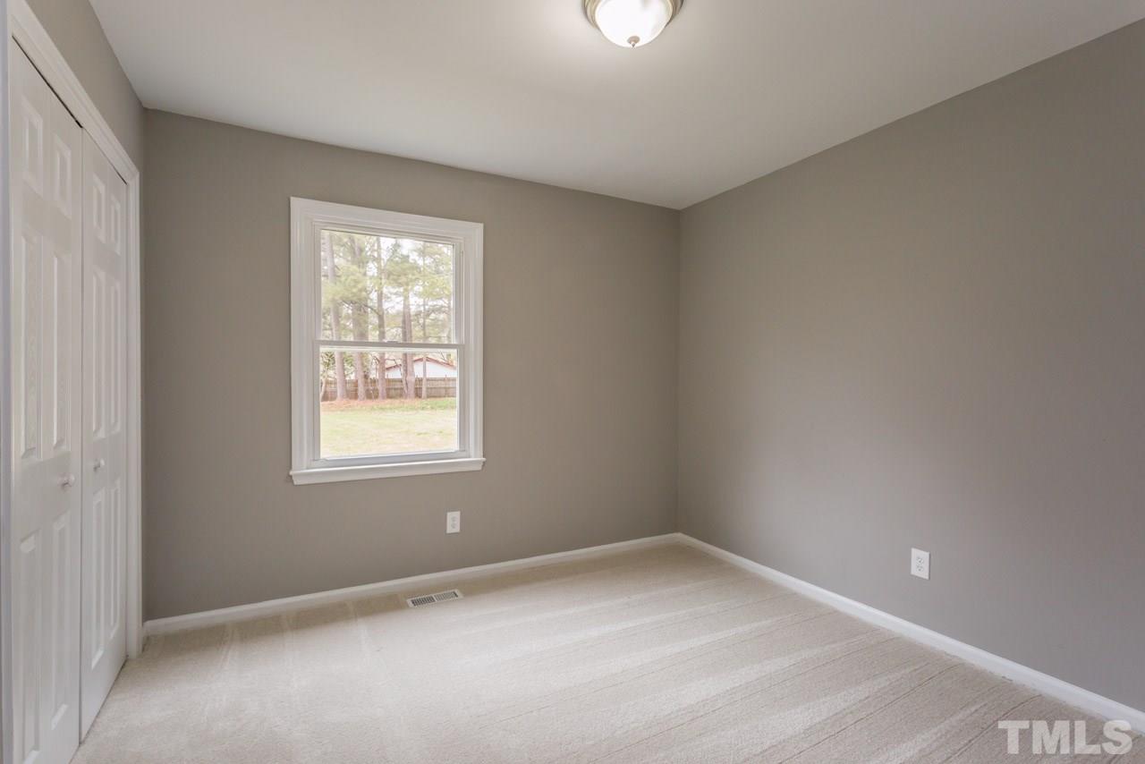 3822 Corwin Road Garner, NC 27529 - Photo 14 of 25 an empty room with a window