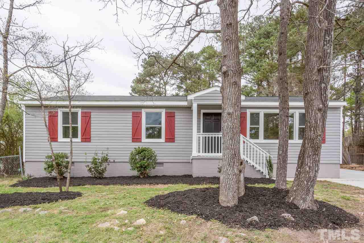 3822 Corwin Road Garner, NC 27529 - Photo 20 of 25 a front view of a house with garden