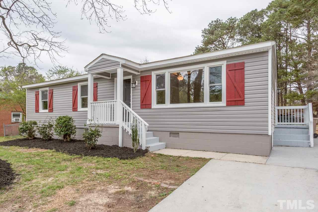 3822 Corwin Road Garner, NC 27529 - Photo 21 of 25 a front view of a house with garden