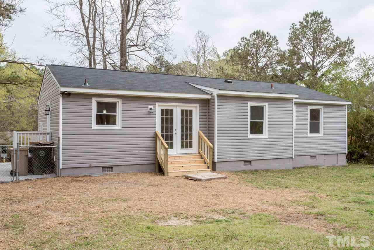 3822 Corwin Road Garner, NC 27529 - Photo 22 of 25 a view of a house with a yard